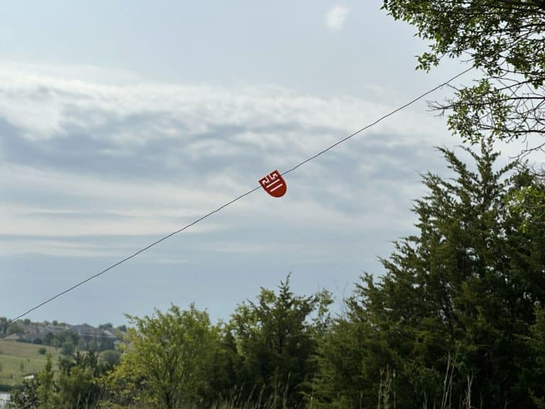 Custom MYOG antenna visibility flag deployed on wire antenna for safe POTA operations
