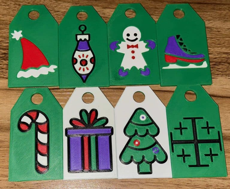 8 tags each showing a custom design, part of one of my mom's Christmas gifts.